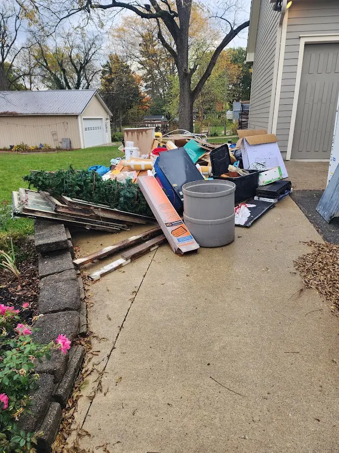 Dumpster being loaded with debris for 3 Yard Dumpster Rental in White Oak